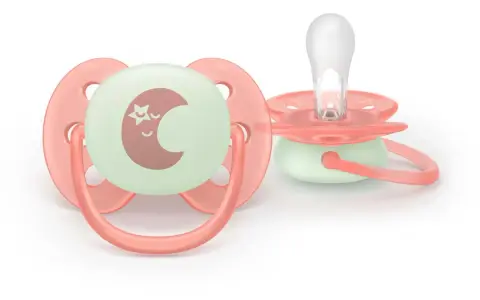 Två Philips Avent Ultra Air 0-6 månaders nappar i korallrosa med självlysande måne och stjärna.