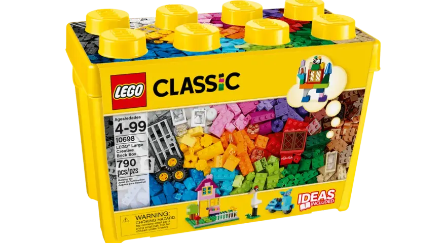En gul lego fantasiklosslåda med 790 delar, full av färgglada klossar för oändliga byggmöjligheter.