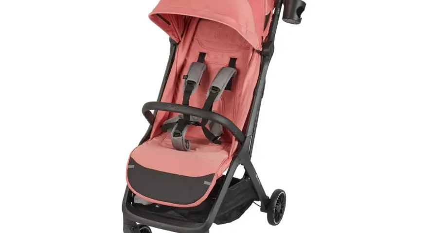 En rosa Kinderkraft sulky med fempunktssele och sufflett. Perfekt för promenader med barnet.