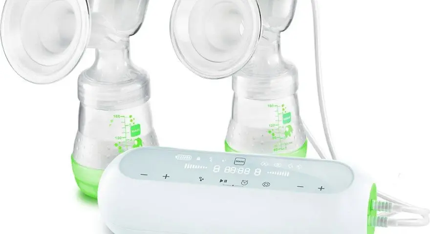 Dubbel bröstpump med Medela Freestyle-enhet. Grön och vit design.